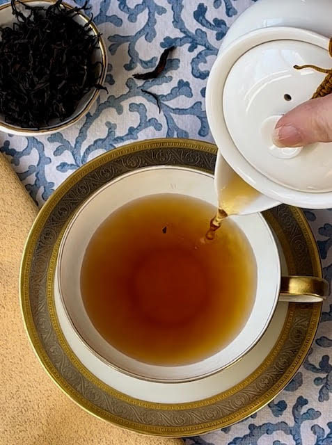Khiri Gold black tea from Teawala pouring from a teapot into a teacup