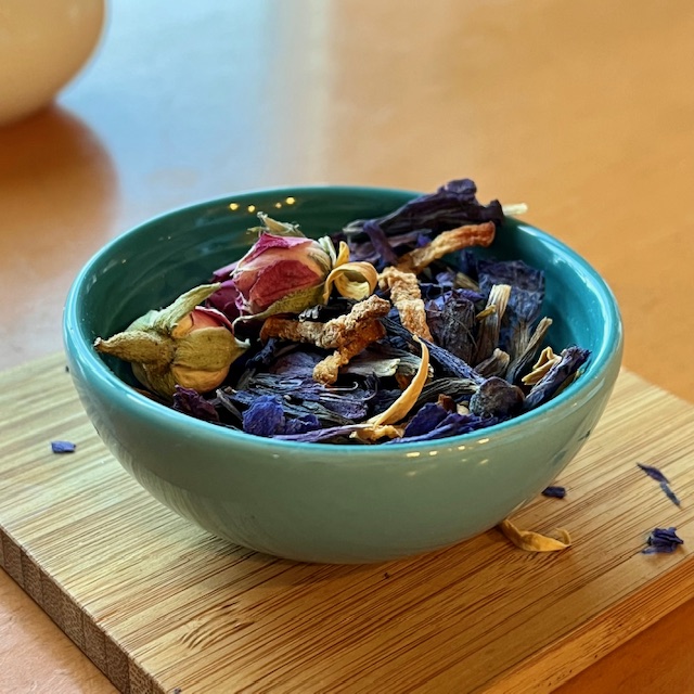 Iranian herbal tea ingredients--borage, rose buds, quince peel, and orange flower blossom.