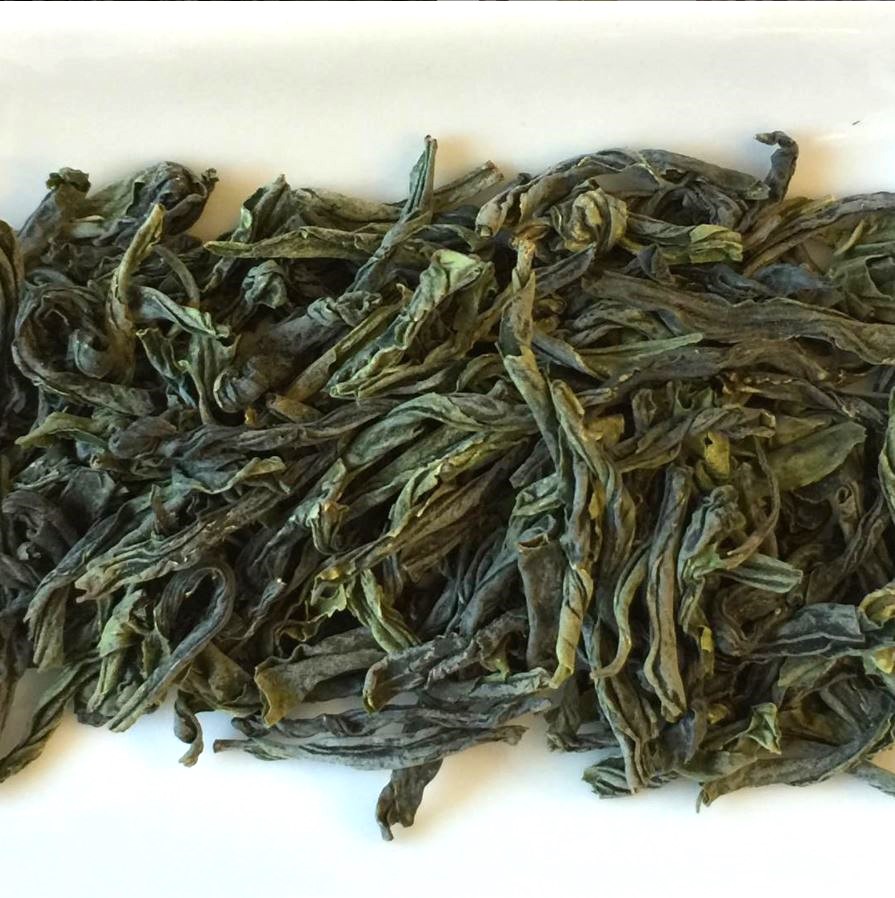 Twisted green gua pian tea leaves