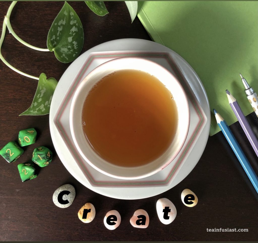 MoTeaVate: image shows a cup and saucer with pebbles underneath, each with a letter that spells the word "create"