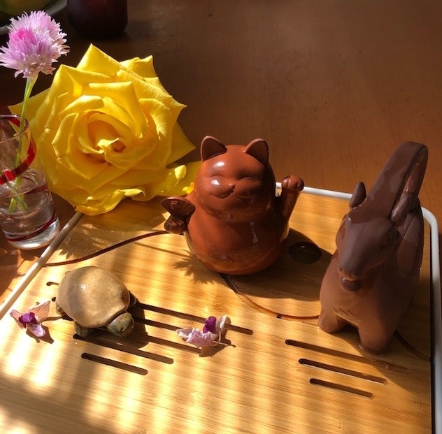 Three tea pets on a gongfu tea tray