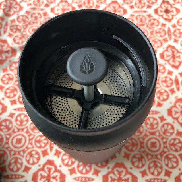 view of tea press, with the plunger partially raised, with Etched filter