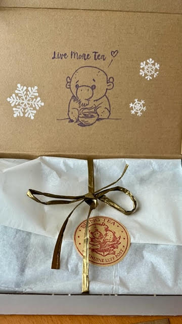 Being Tea's mascot, Luff, stamped and as a sticker inside the Being Tea tea tasting box.