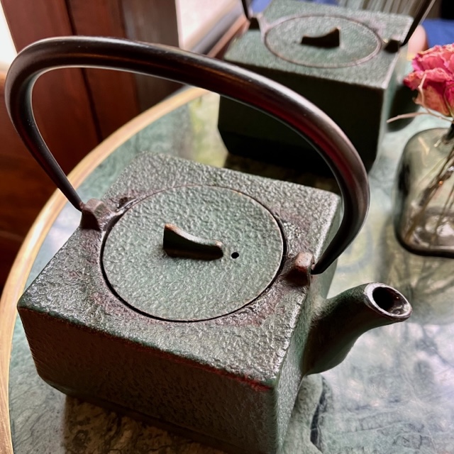Two rectangular, cast iron tea kettles at Paquita in Manhattan.