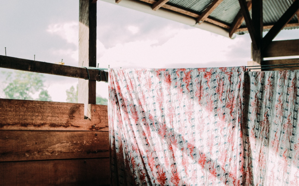 Memory of flowered cotton sheets hanging on a clothes line.