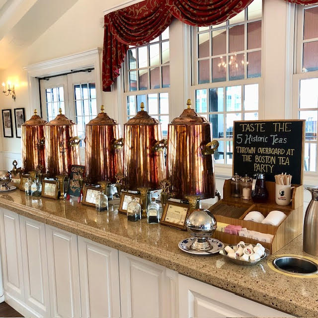 5 copper urns of teas on a counter at the Boston Tea Party Ships & Museum