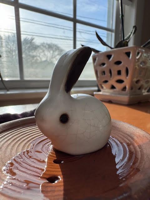 White rabbit teapet on a clay tea tray.