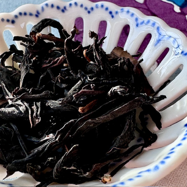Dark black and twisted tea leaves of Native Cultivar Reserve from Red Blossom Tea