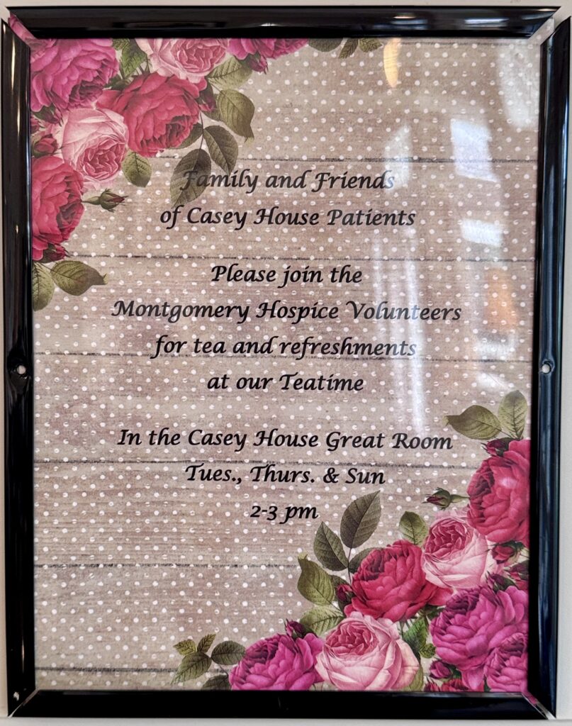 Sign at Casey House sharing about their volunteer-led tea times where you can sip from a cup full of compassion