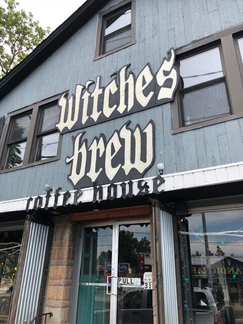 The exterior of Witches Brew on Long Island--the building has gray wooden planks