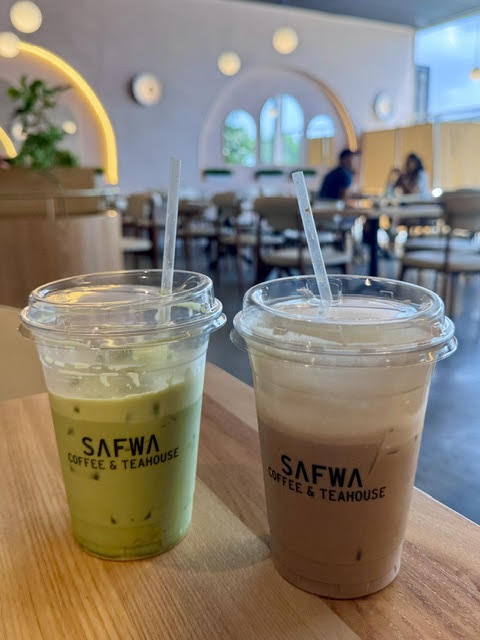 An iced pistachio matcha and iced Afghan chail on a table at Safwa Coffee & Teahouse in Westbury